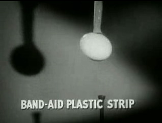 picking up an egg with a Band-Aid