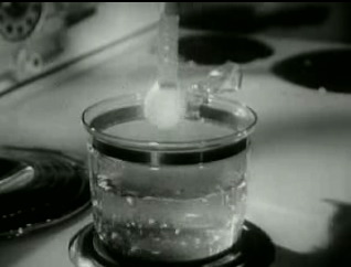 boiling an egg suspended by a Band-Aid
